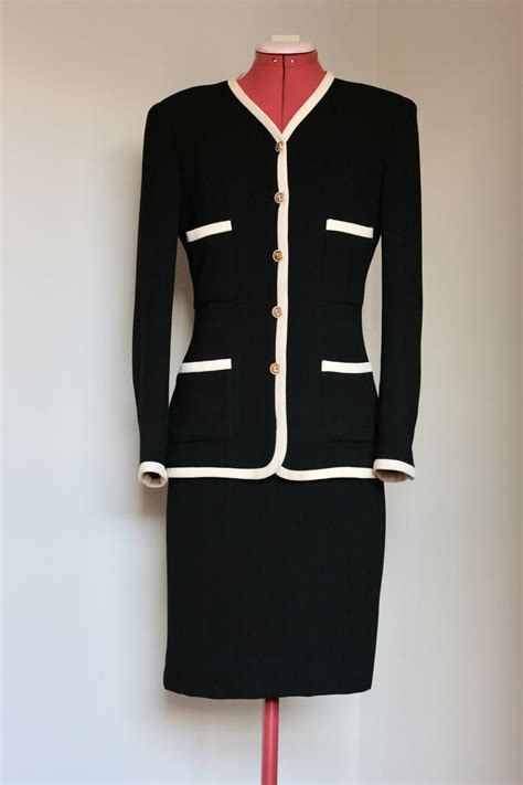 legendary chanel suit with collarless jacket and well-fitted skirt|the chanel suit.